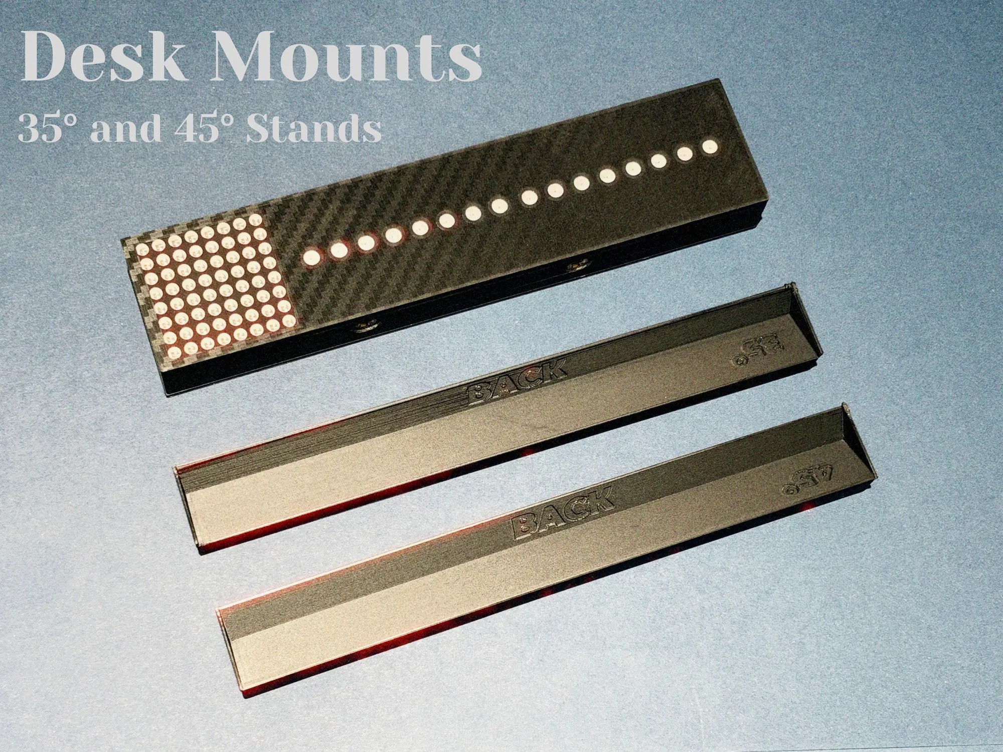 The desk stands: the unit beside the two angled stands it sits on, one at 35 degrees and one at 45