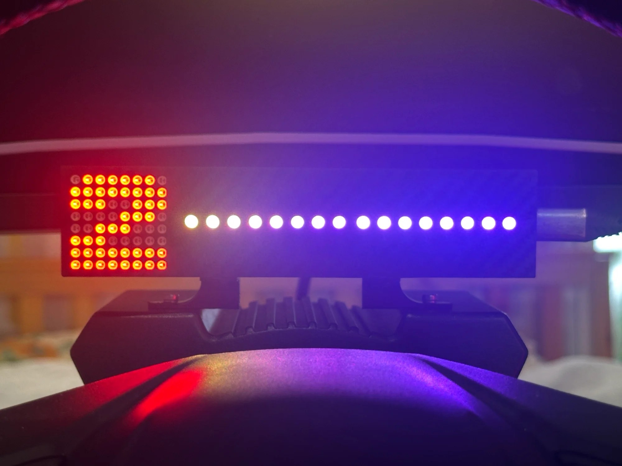 Close-up of the 8x8 red matrix showing second gear next to the 16 individually lit shift LEDs