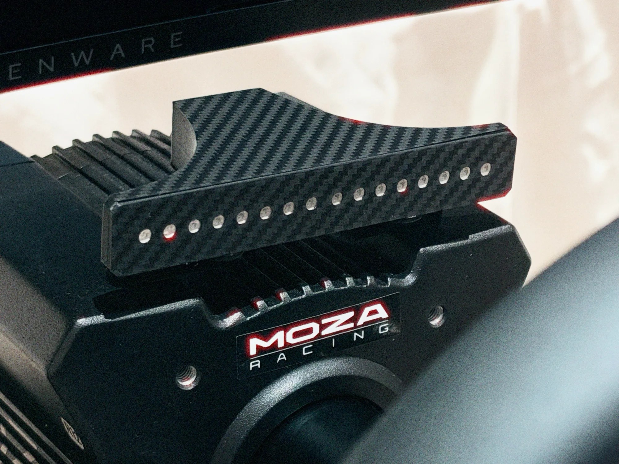 Shift Lights Pro unlit on a MOZA wheelbase in daylight, showing the carbon-effect face and the 16 LED apertures