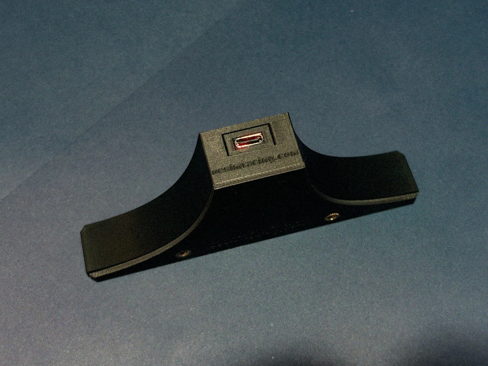 Underside of the Shift Lights Pro, showing the USB-C socket and the two feet the mount bolts into