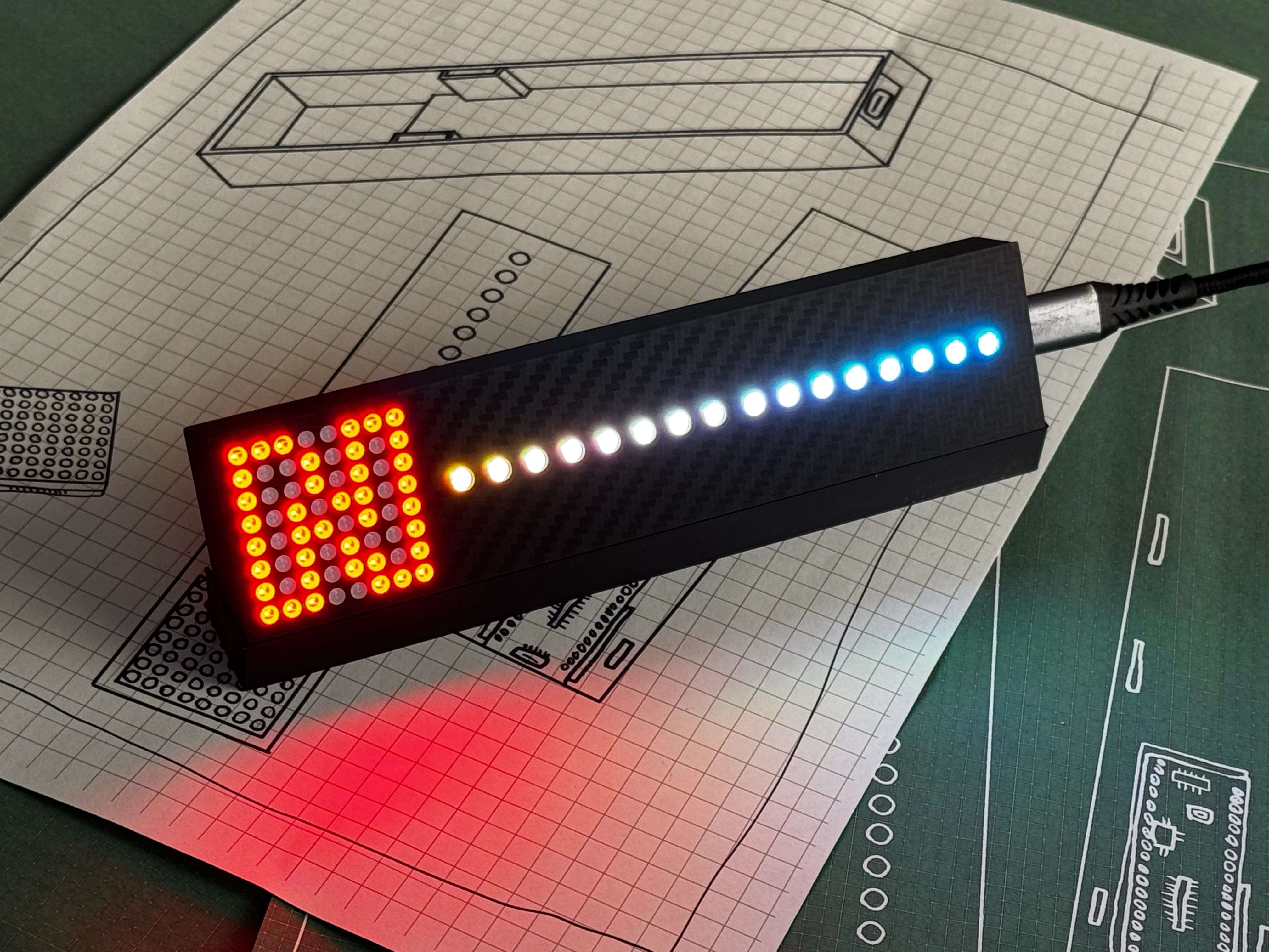 Gear Indicator + Shift Lights showing a custom white-to-blue rev sweep with the red gear matrix on design blueprints - fully customisable ARGB LEDs, carbon-fibre body